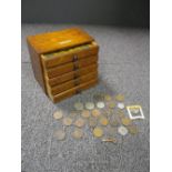 An early 20th century oak sample plan chest by F. Davidson & Co., London, containing various