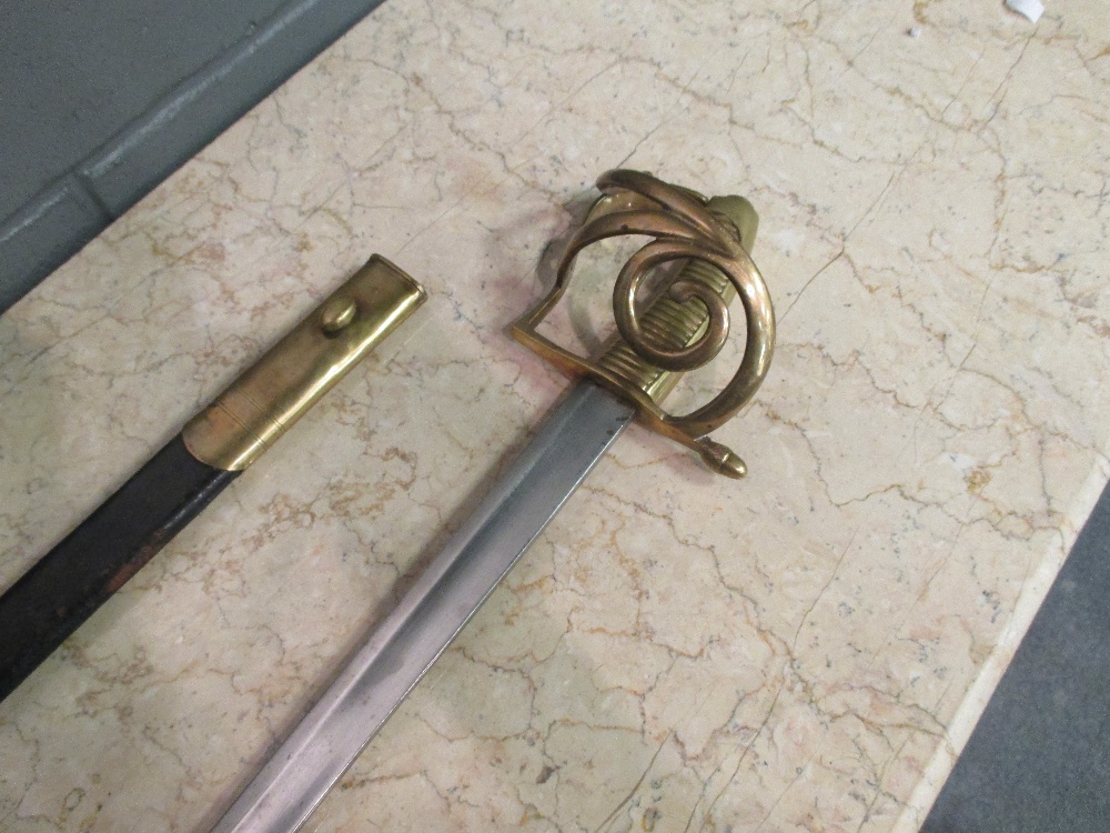 A Danish brass hilted sword in leather scabbard, bears BGC stamp for 'Den Bestandige