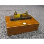 A mounted terminal block marked three tenths micro farard, by Reynolds and Branson, Leeds,