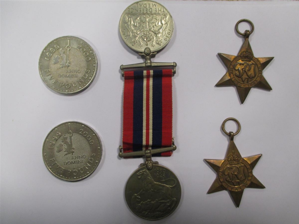 A collection of WWII medals, including 1939-1945 Star, Africa Star, Italy Star, Defence Medal, a