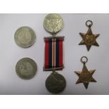 A collection of WWII medals, including 1939-1945 Star, Africa Star, Italy Star, Defence Medal, a