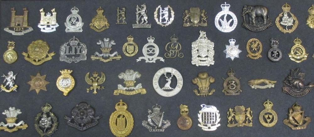 A collection of approximately one thousand military brass and other cap badges, mostly early 20th