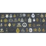 A collection of approximately one thousand military brass and other cap badges, mostly early 20th