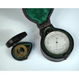 A circular pocket combination thermometer, compass and barometer, unsigned, housed in a fitted