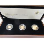 A UK 2010 gold sovereign three coin set, sovereign to a quarter sovereign