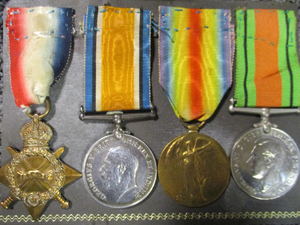 A World War One trio to 2038 Sgt W White, Essex R, and a 1939-1945 Defence medal, together with a