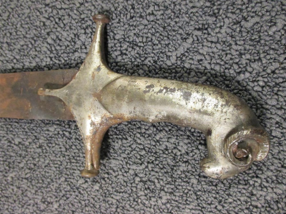 An Indian Tulwar, with heavy curved blade and silvered rams head pommel, together with an Eastern - Bild 4 aus 4