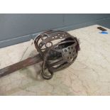 A Victorian Scottish basket hilt sword, standard pattern, the rusted etched blade and with proof