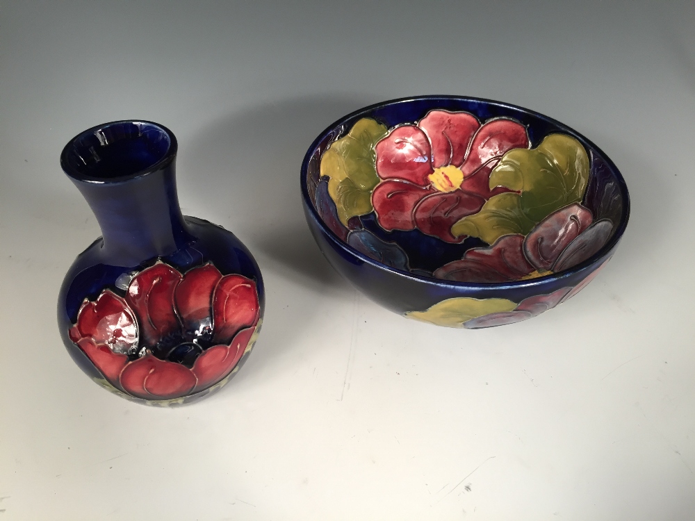 A Moorcroft Clematis pattern bowl, decorated to a deep blue ground, painted and impressed marks,