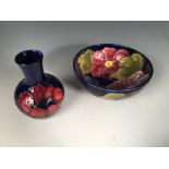 A Moorcroft Clematis pattern bowl, decorated to a deep blue ground, painted and impressed marks,