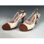 Ferragamo, a pair of two-tone, slingback pumps with platform, cream leather body with brown