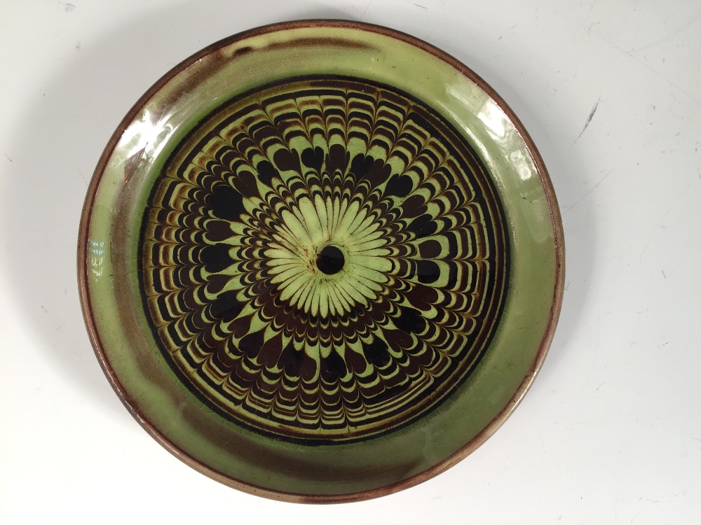 Sidney Tustin for Winchcombe Pottery, a set of six slipware side plates, each of circular form - Image 2 of 3