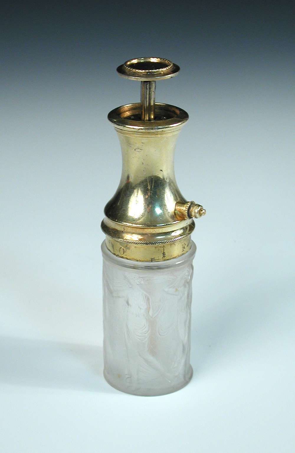 A René Lalique Figurines et Guirlandes pattern frosted glass atomiser, with gilt metal mounts,