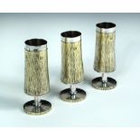 Three small silver and silver gilt sherry goblets by Asprey & Co., London 1973, each of textured