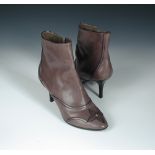 Louis Vuitton, a pair of grey leather zip up ankle boots, with rubber sole and stiletto heels,