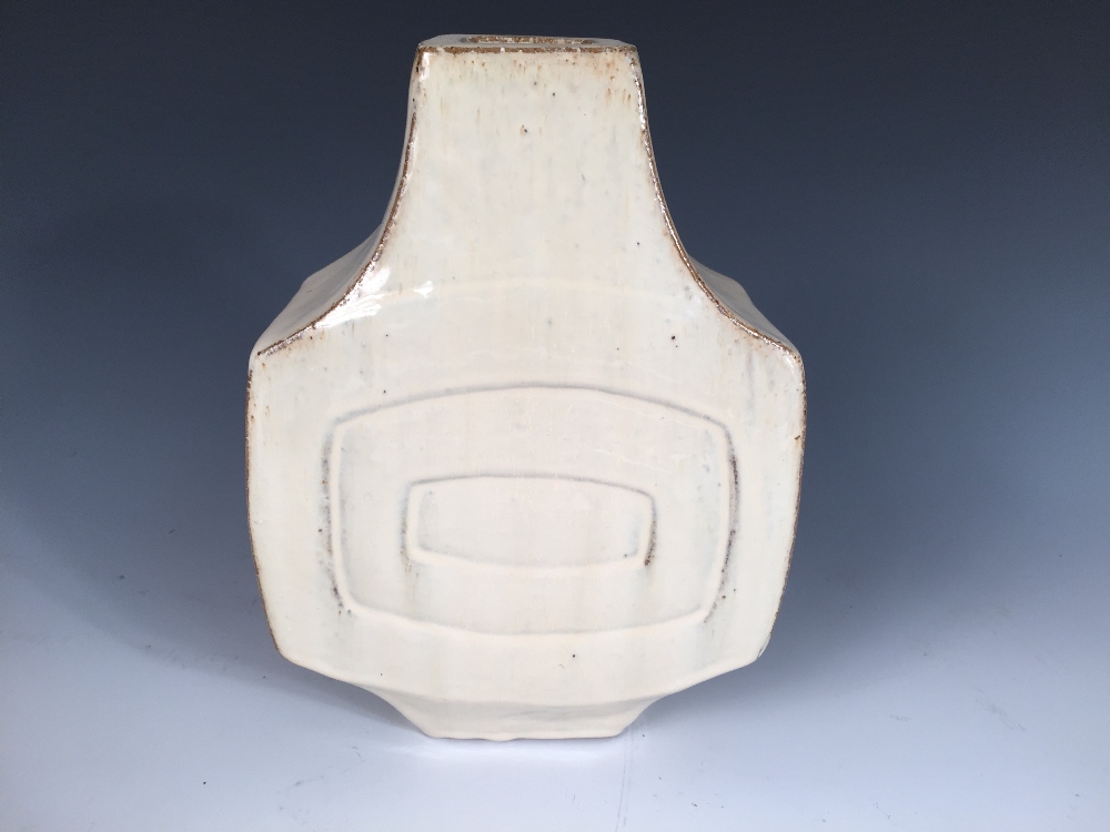 A 1960's or 70's stoneware vase by Habitat, the banjo shaped body with concentric rectangle