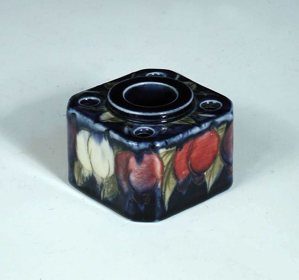 A Moorcroft Wisteria pattern inkwell, the square form with canted corners, the top with central well