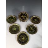 Sidney Tustin for Winchcombe Pottery, a set of six slipware side plates, each of circular form