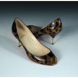 Christian Louboutin, a pair of animal print peep-toe shoes, patent, 8cm stiletto with gold tip,