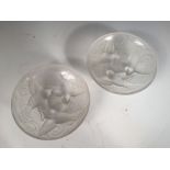 Two small frosted glass dishes in the manner of Lalique, each moulded with birds and marked 'France'