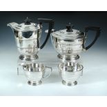 An Art Deco four-piece silver tea set, Walker and Hall, Sheffield 1938, comprising teapot of