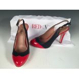 RED V, a pair of slingback two tone red patent/navy leather stilettos, with 10cm heel with inbuilt