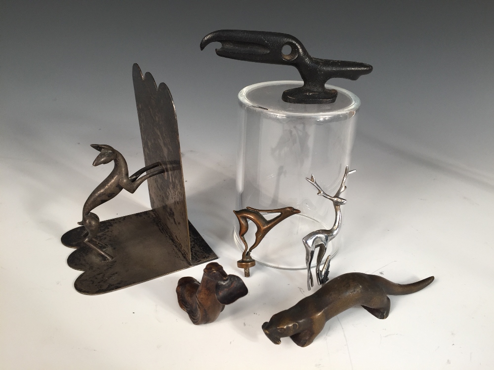 A Hagenauer electroplate bookend, in the form of a jumping dog, together with five other small