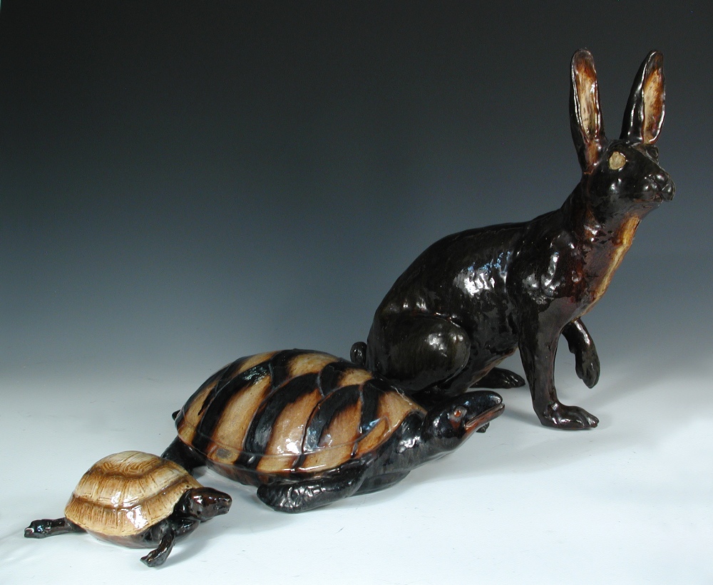 Bavent', Normandy, a small group of three treacle glazed pottery animals, comprising a large hare