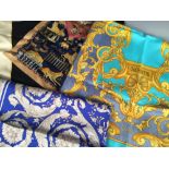 Three silk scarves, comprising one Ferragamo and two boxed Versace examples Pristine