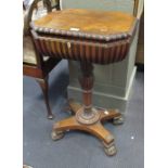 A Regency rosewood teapoy, with a fitted interior for canisters and mixing bowls, fluted mouldings