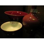 A peach bloom vase, six character mark of Kangxi together with two flambe bowls (3) See images as