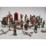 A collection of model painted soldiers by Britains and others, to include two horsedrawn