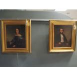 English School (19th century) three-quarter length portraits, both seated, oil on canvas, a pair,