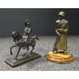 An early 20th century Russian bronze figure of a knight on horseback, signed indistinctly to the