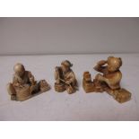 Three late 19th/early 20th century netsuke of seated crafts people, the largest signed, 4cm (1.5 in)