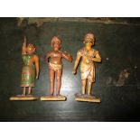 EG. A pair and another Kashmiri lacquered plaster figure, 22cm (8.75 in) high (3)