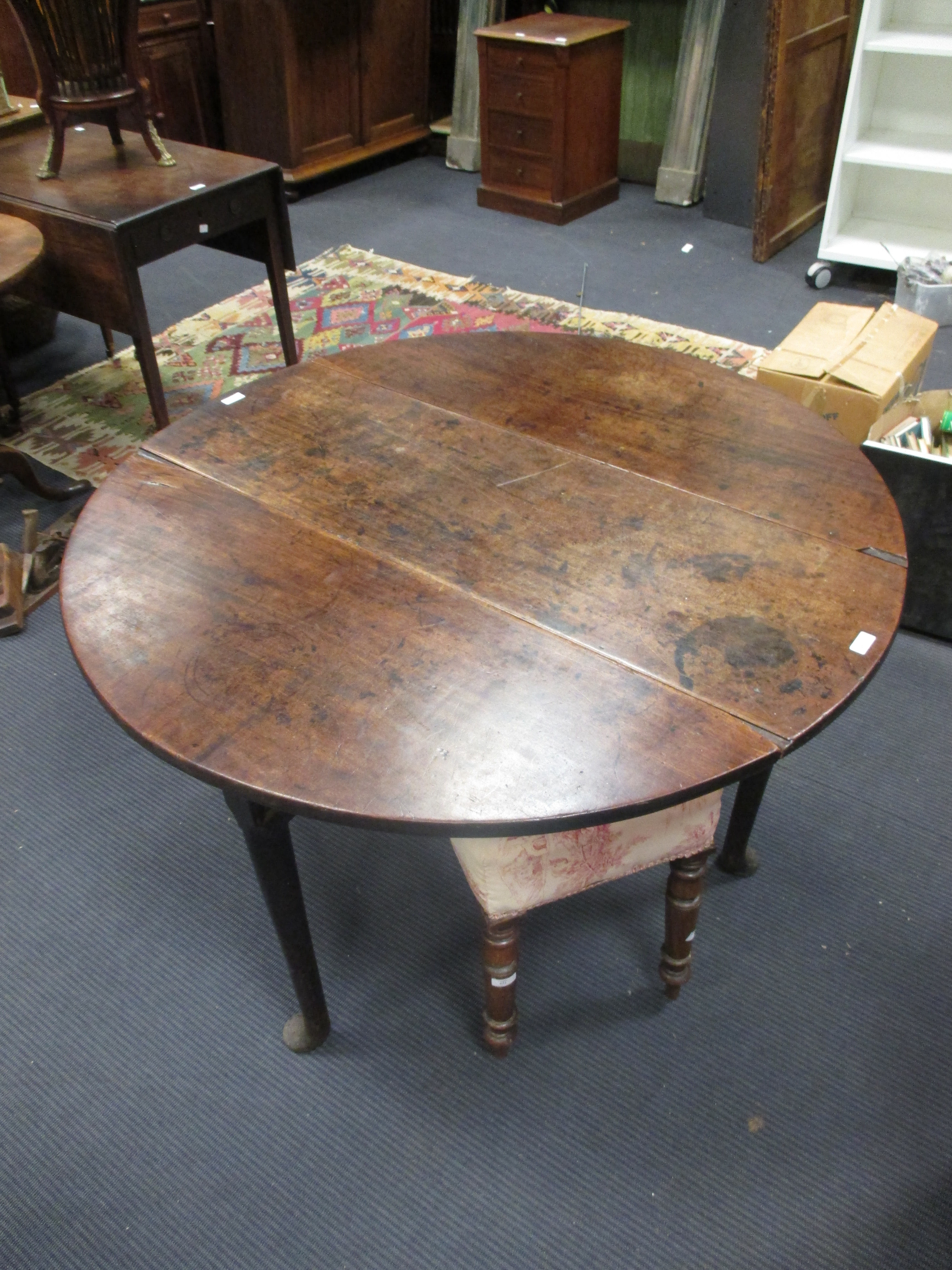 A mahogany pad foot table