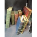 A collection of eight books with printed cloth covers