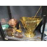 Brassware to include a scuttle, andirons, a charcoal iron, a brass jardiniere and fire tools