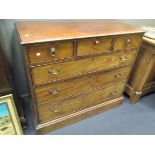 An early 19th century mahogany chest of drawers, fitted three small drawers and three long