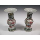 A matched pair of Chinese famille verte yenyen vases bearing six character mark of Jiajing