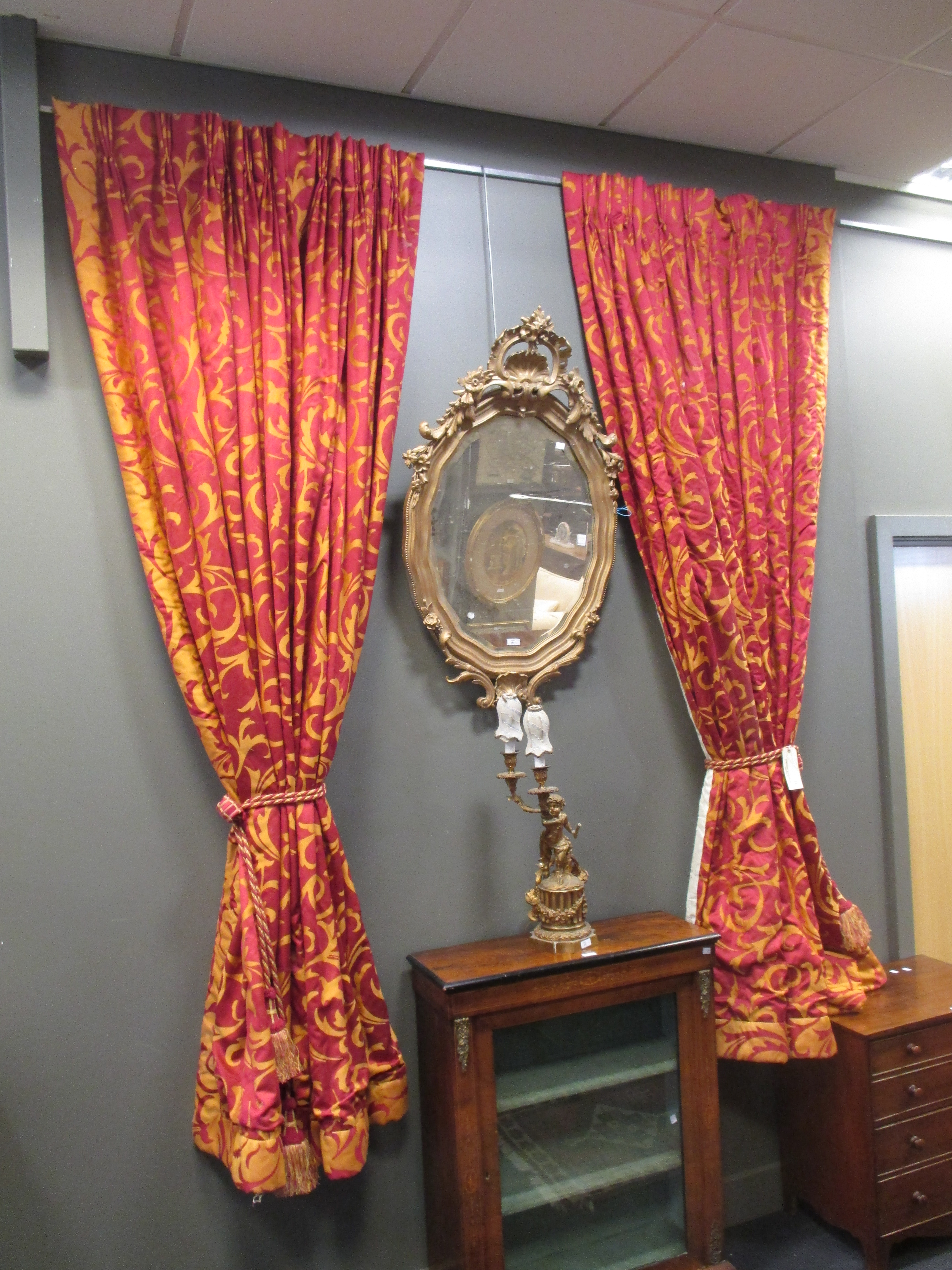 A pair of heavy red and gold curtains with tie backs and matching pelmet 250cm long approximately