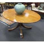 A George III mahogany oval supper table, on turned column and four moulded splayed legs, 72cm