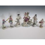 Six continental porcelain figurines including a pair of a young boy and girl with pseudo Derby marks