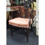 A set of four mahogany elbow chairs