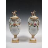 A pair of continental four handled floral encrusted lidded vases, 62cm (2)