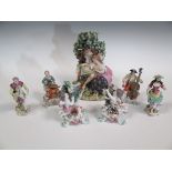 Seven continental porcelain figurines to include a pair of putti, pair of musicians and larger