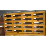 An oak Haberdashery cabinet, with glass front drawers, 94 x 176 x 54cm