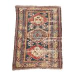 A Shirvan rug, Azerbaijan, worn 198 x 128cm (77 x 50in) Very worn, but colours are still strong