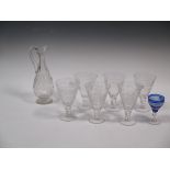 A set of six vine leaf etched glasses with carafe and blue glass wine glass